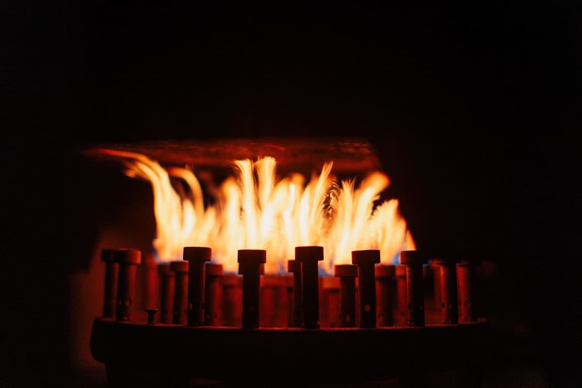 A gas flame burning against a dark background
